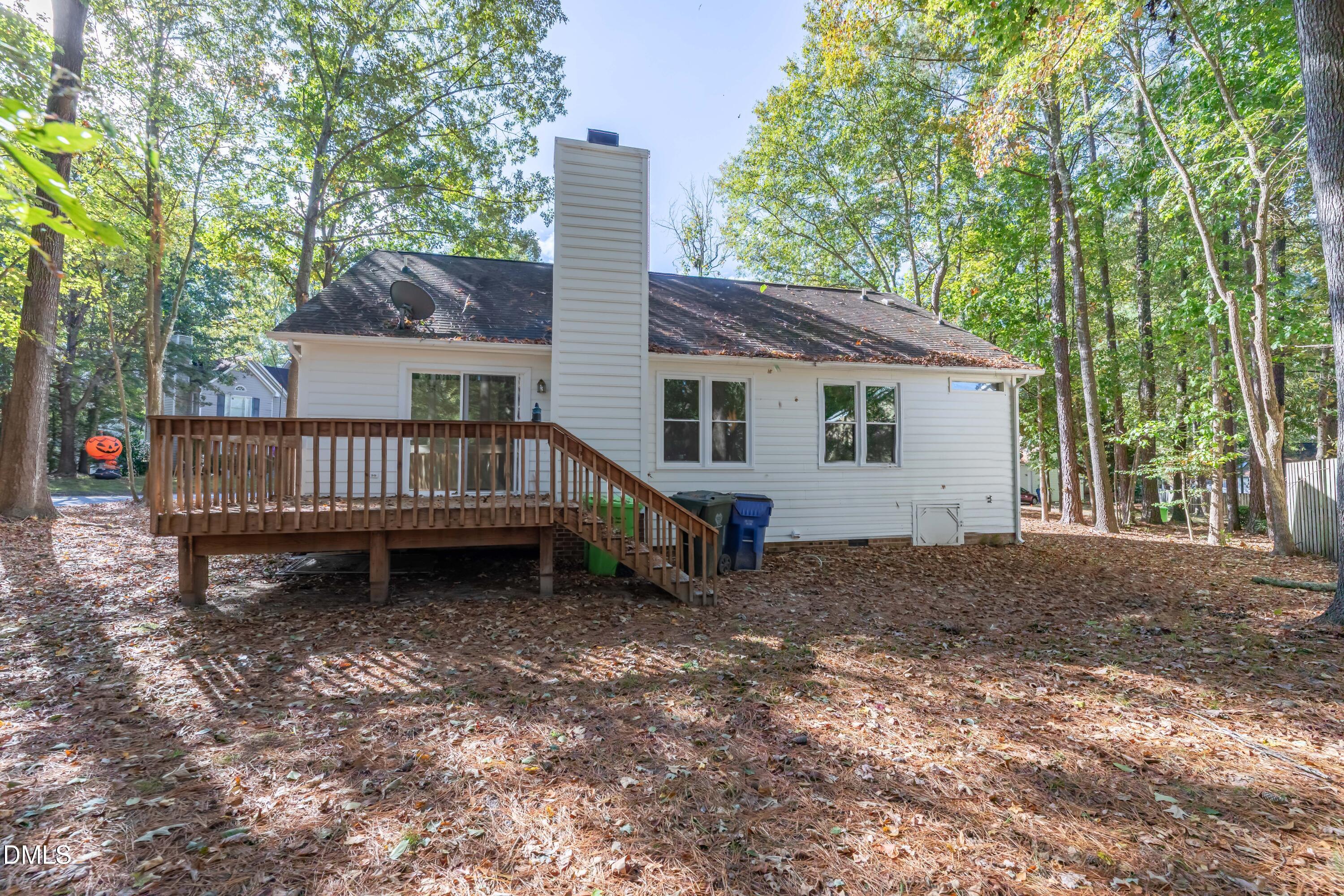 3609 Singleleaf Lane Raleigh, NC 27616 - Photo 30 of 41 a view of a house with a yard and deck