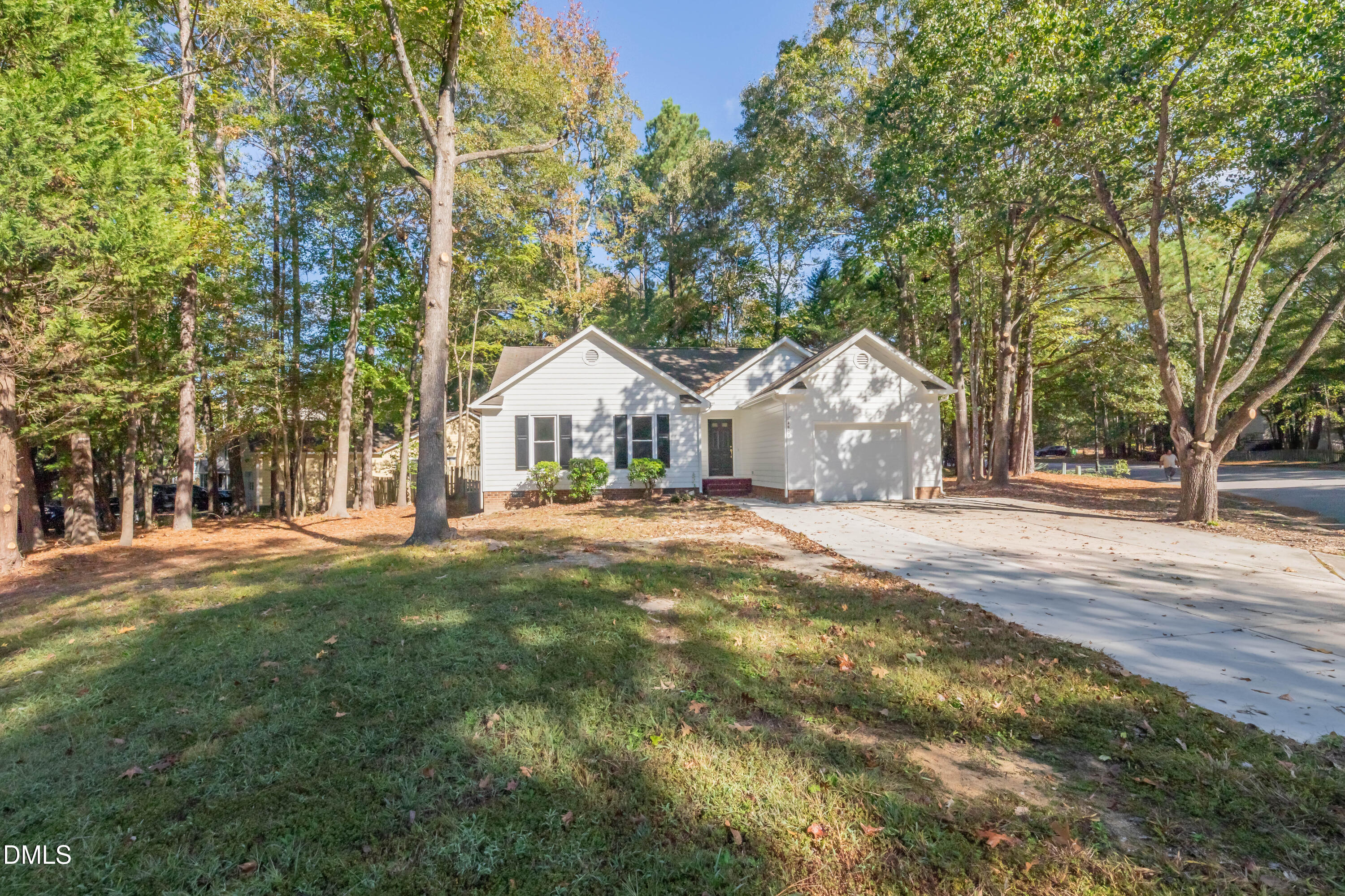 3609 Singleleaf Lane Raleigh, NC 27616 - Photo 32 of 41 a front view of a house with a yard and garage