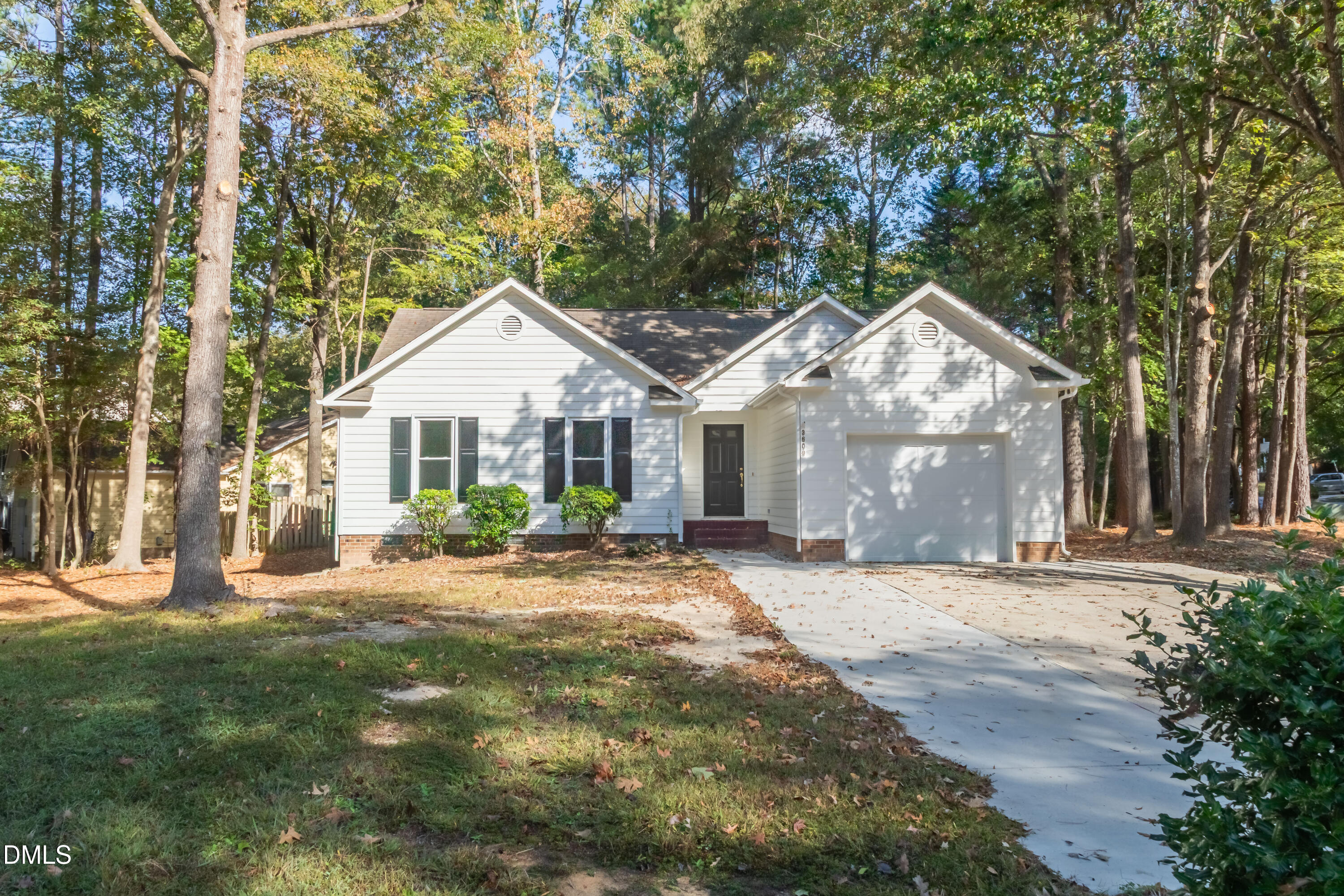 3609 Singleleaf Lane Raleigh, NC 27616 - Photo 33 of 41 a front view of a house with a garden and yard