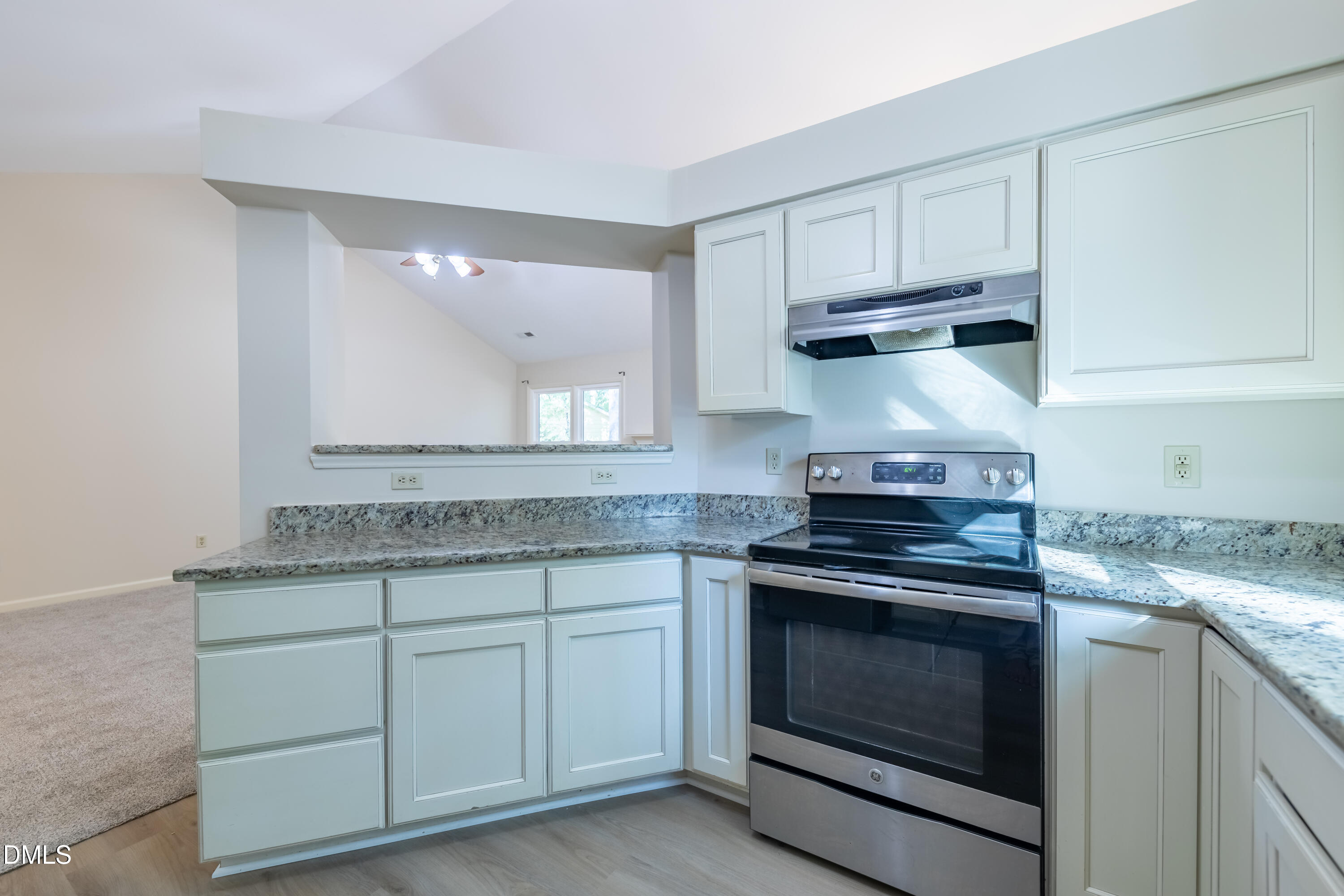 3609 Singleleaf Lane Raleigh, NC 27616 - Photo 10 of 41 a kitchen with white cabinets and appliances