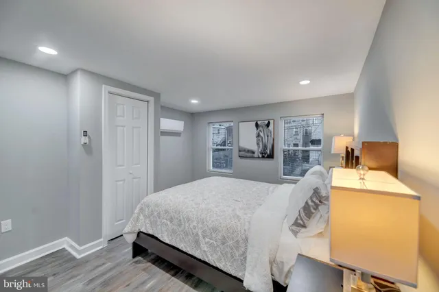 a bed room with a bed and a chair