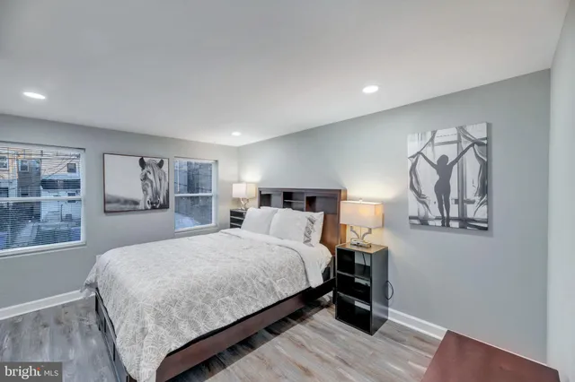 a bedroom with a large bed and a table