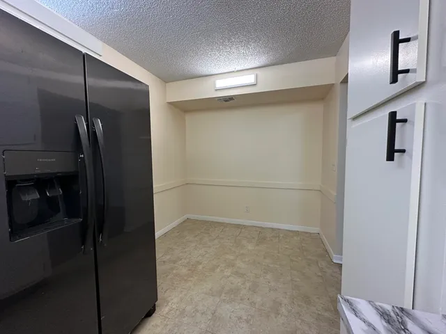 a bathroom with a shower and a glass door