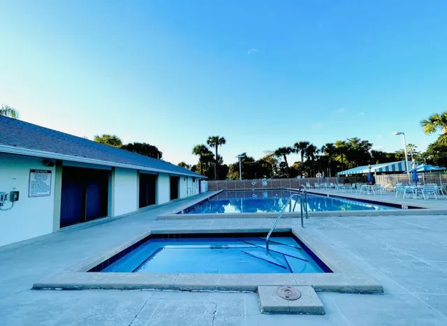a view of swimming pool with seating space