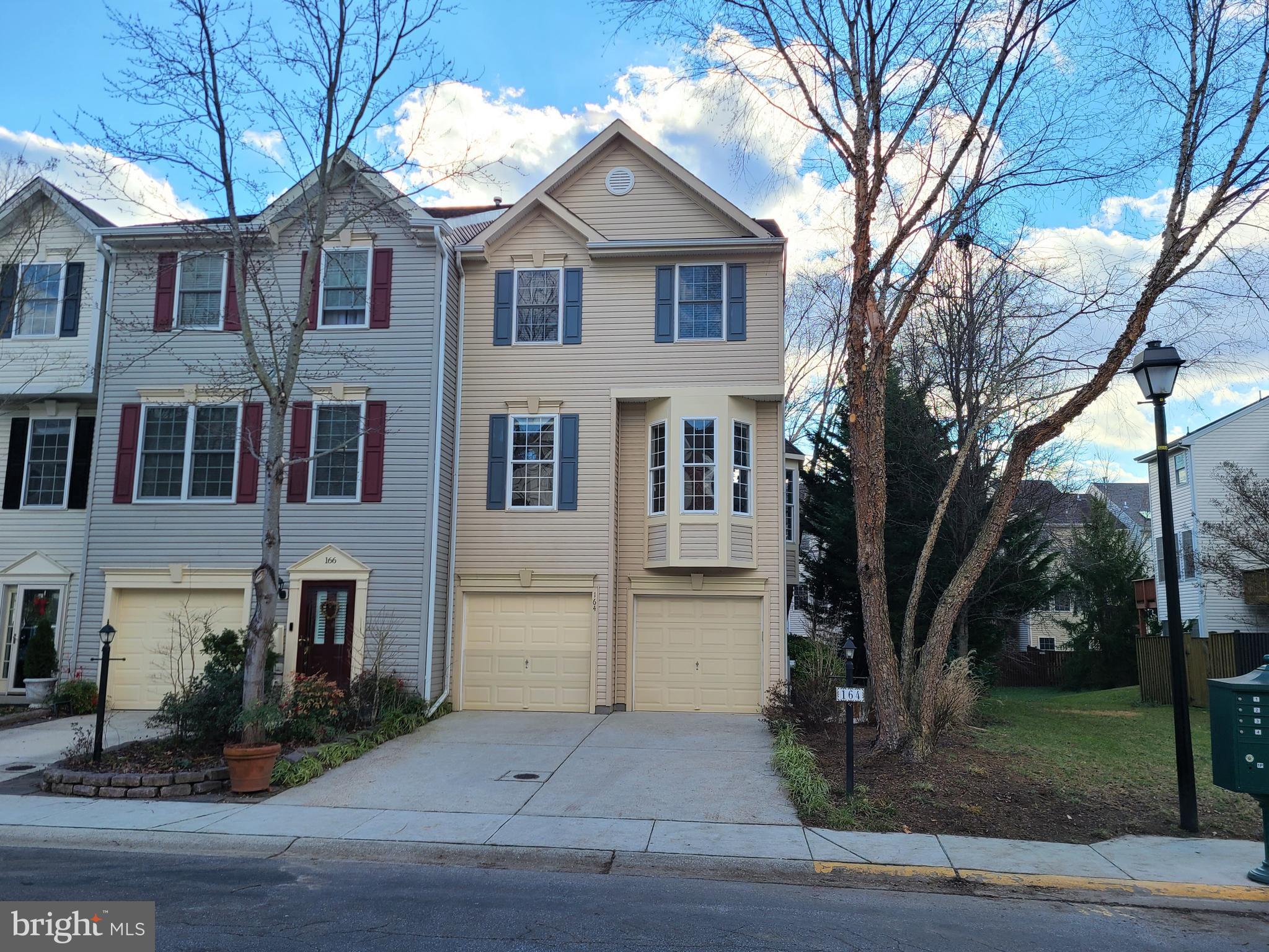 a front view of a house with yard