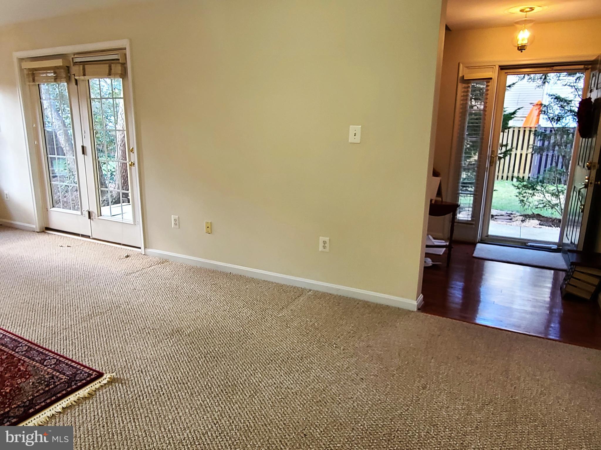 164 Tilden Way, Unit 164 Edgewater, MD 21037 - Photo 24 of 34 an empty room with wooden floor and windows