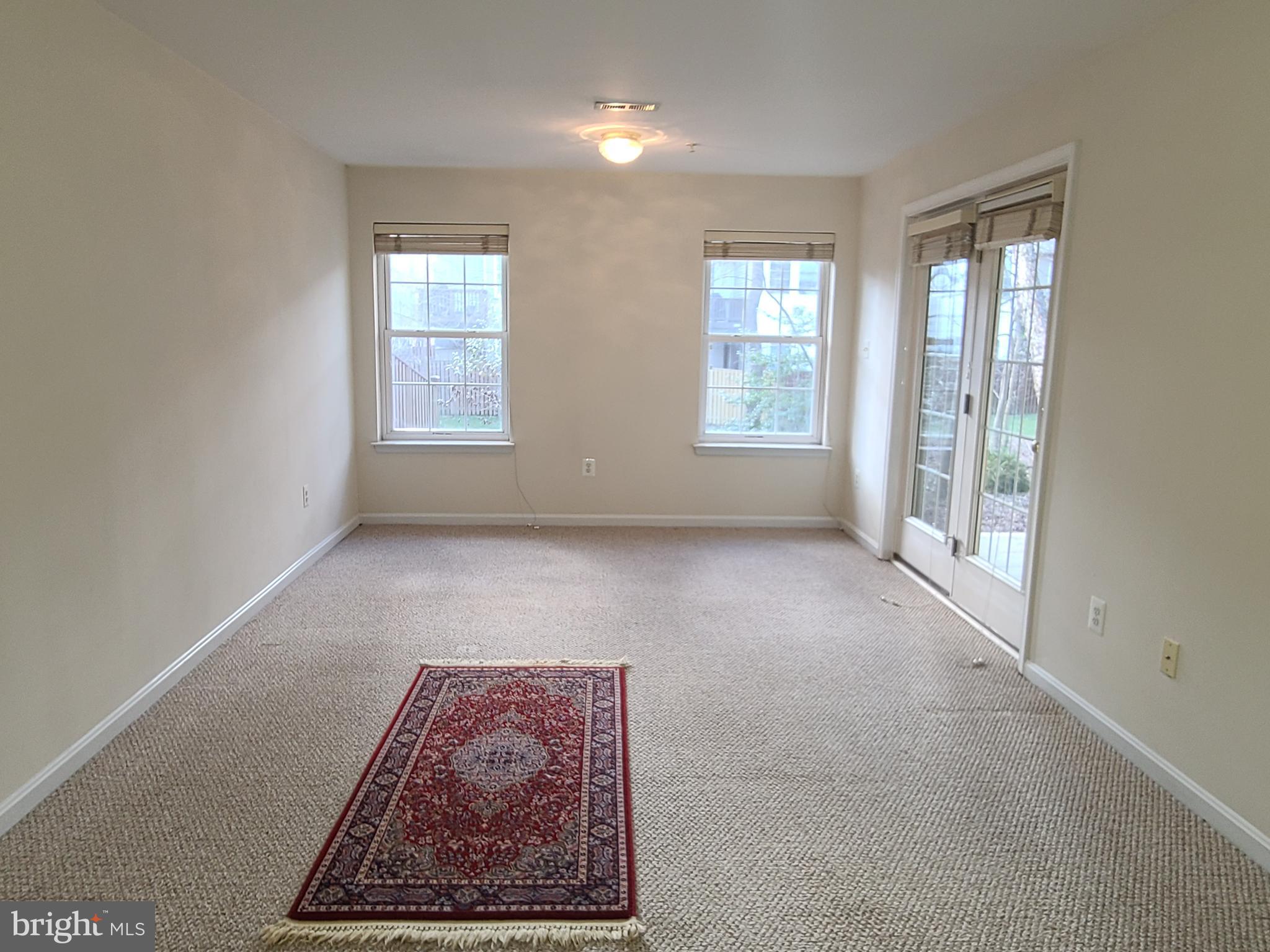 164 Tilden Way, Unit 164 Edgewater, MD 21037 - Photo 25 of 34 an empty room with windows