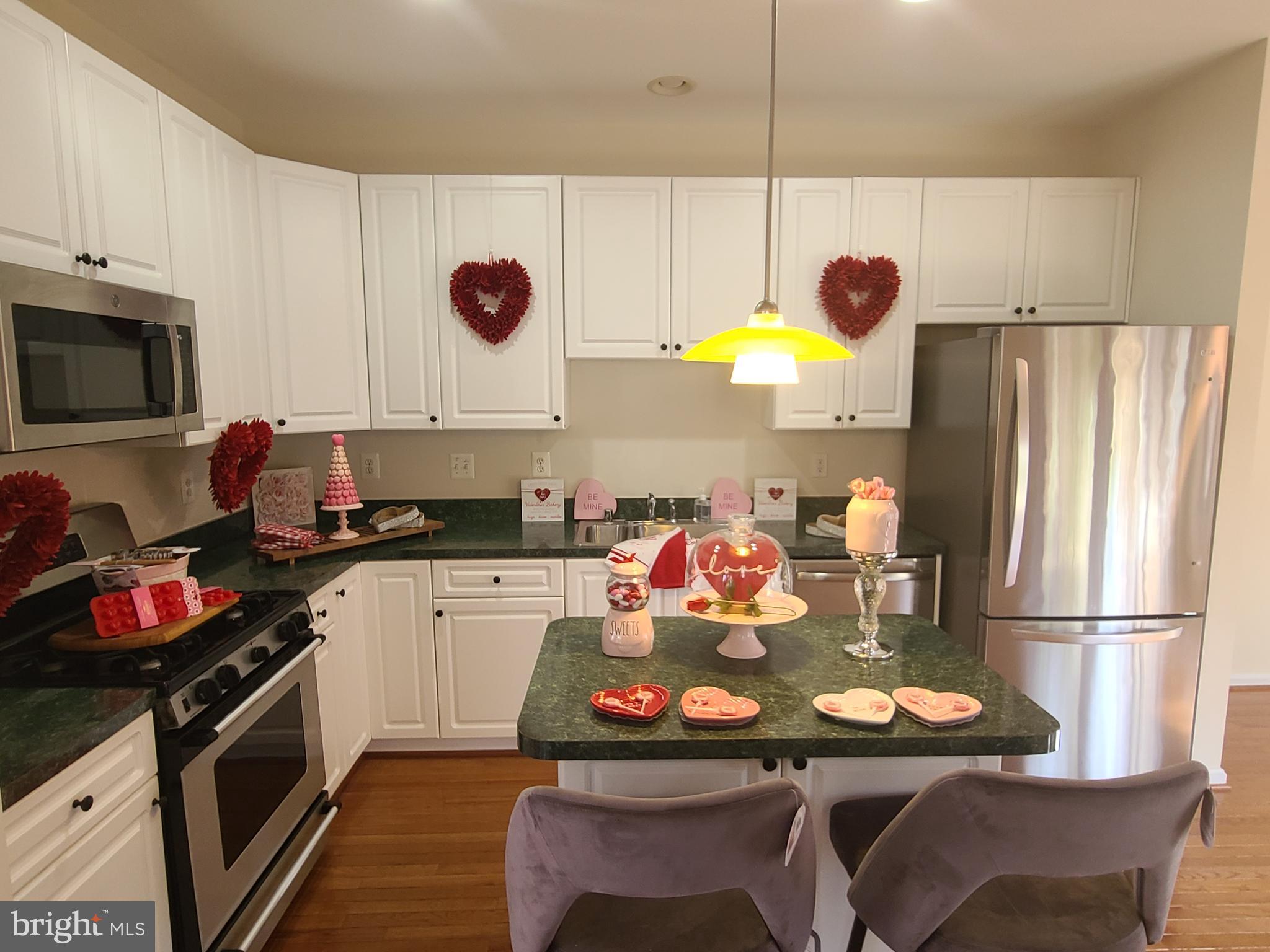 164 Tilden Way, Unit 164 Edgewater, MD 21037 - Photo 6 of 34 a kitchen with a sink appliances and cabinets