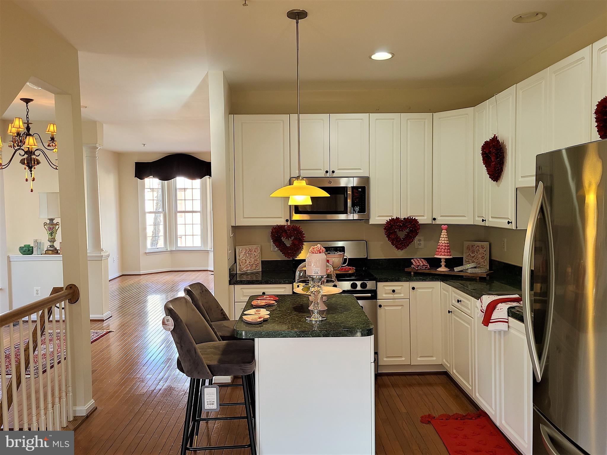 164 Tilden Way, Unit 164 Edgewater, MD 21037 - Photo 9 of 34 a kitchen with a sink appliances and cabinets