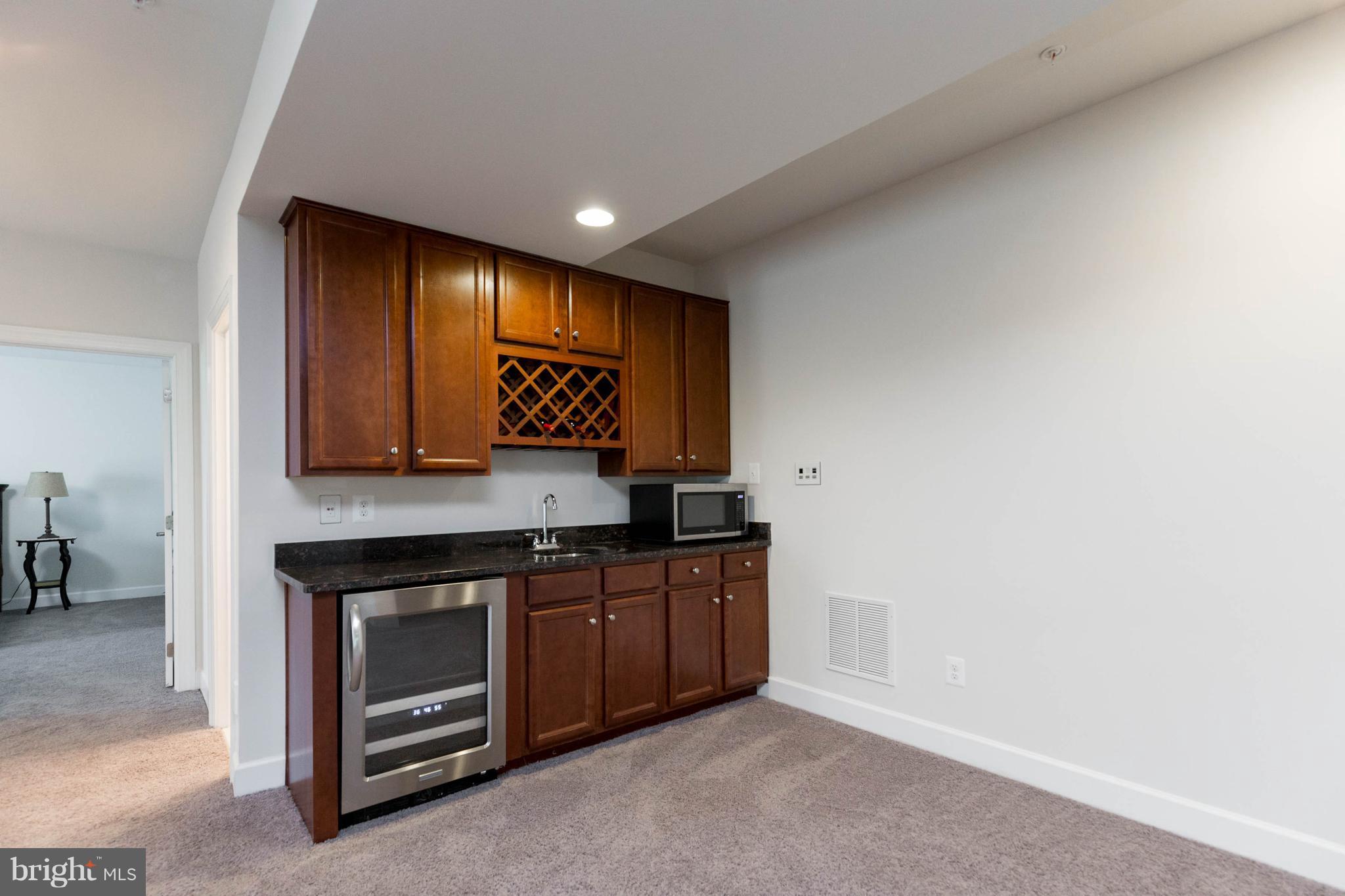 3706 Waterford Mill Road Bowie, MD 20721 - Photo 23 of 35 Wet Bar in the Basement