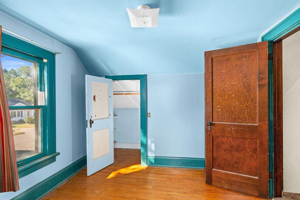 434 12th Street Cloquet, MN 55720 - Photo 14 of 22 Unfurnished bedroom featuring wood finished floors and lofted ceiling