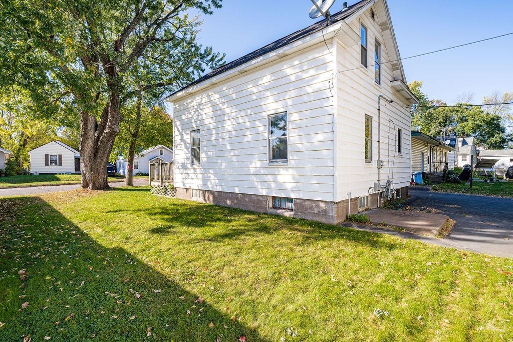 434 12th Street Cloquet, MN 55720 - Photo 19 of 22 View of property exterior featuring a yard