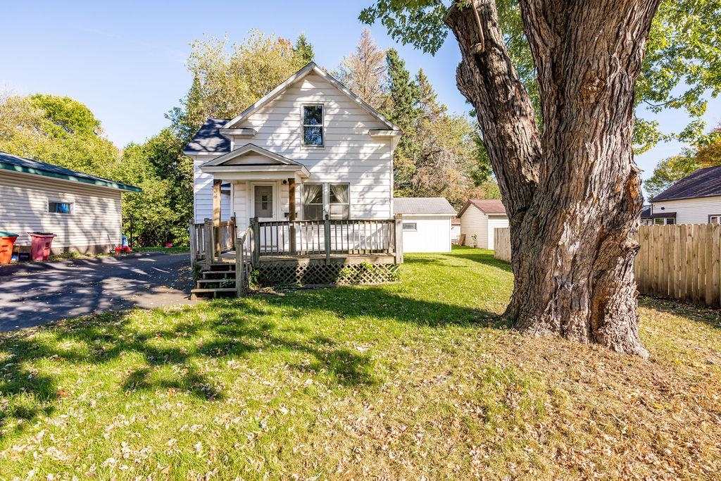 434 12th Street Cloquet, MN 55720 - Photo 22 of 22 View of front of property with a wooden deck and a front lawn