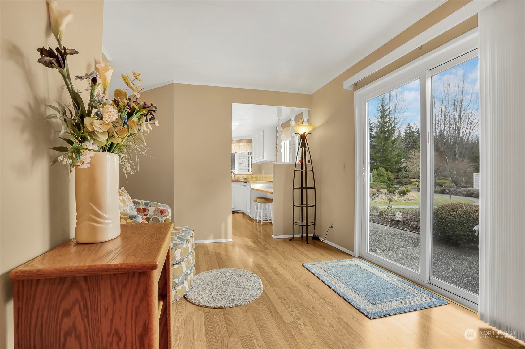 23921 Lake Drive West Bothell, WA 98021 - Photo 12 of 40 a living room with furniture and a floor to ceiling window