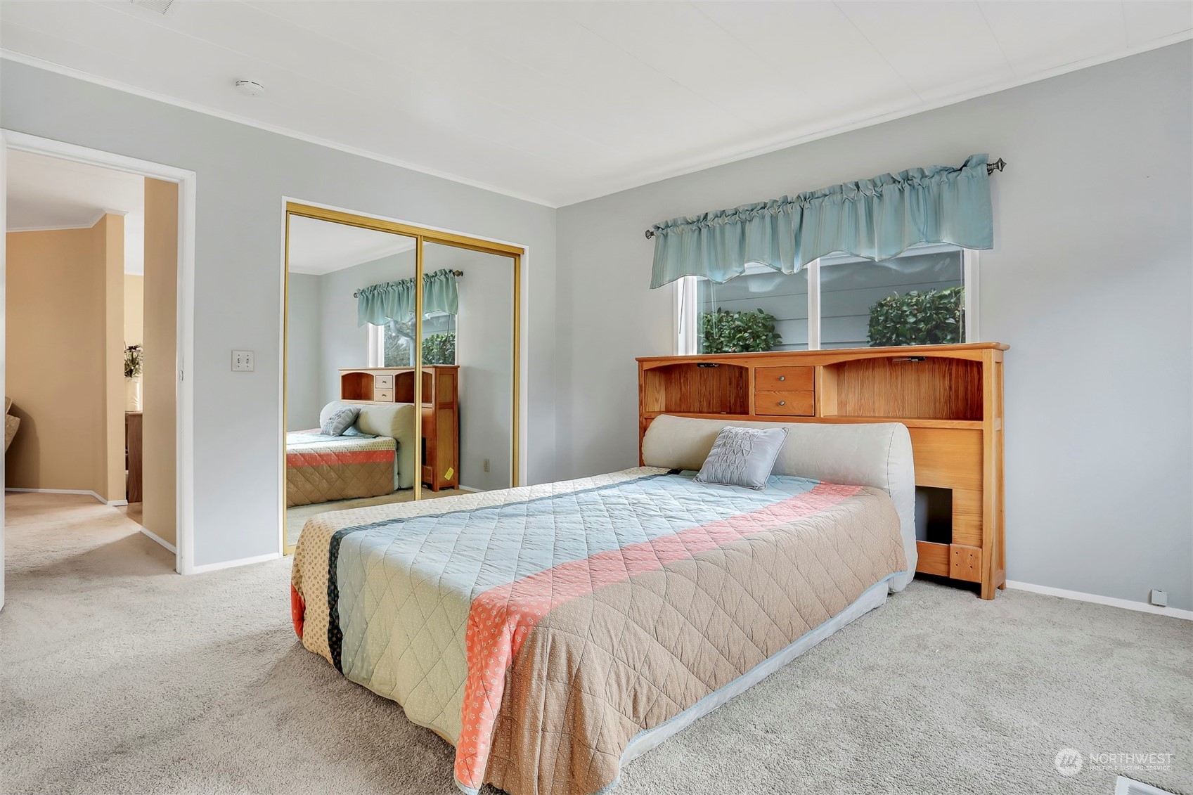 23921 Lake Drive West Bothell, WA 98021 - Photo 20 of 40 a bedroom with a bed and wooden floor