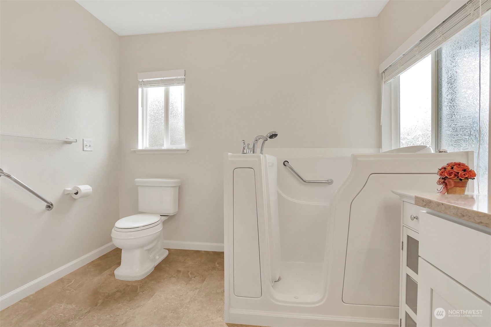 23921 Lake Drive West Bothell, WA 98021 - Photo 24 of 40 a bathroom with a toilet sink and shower