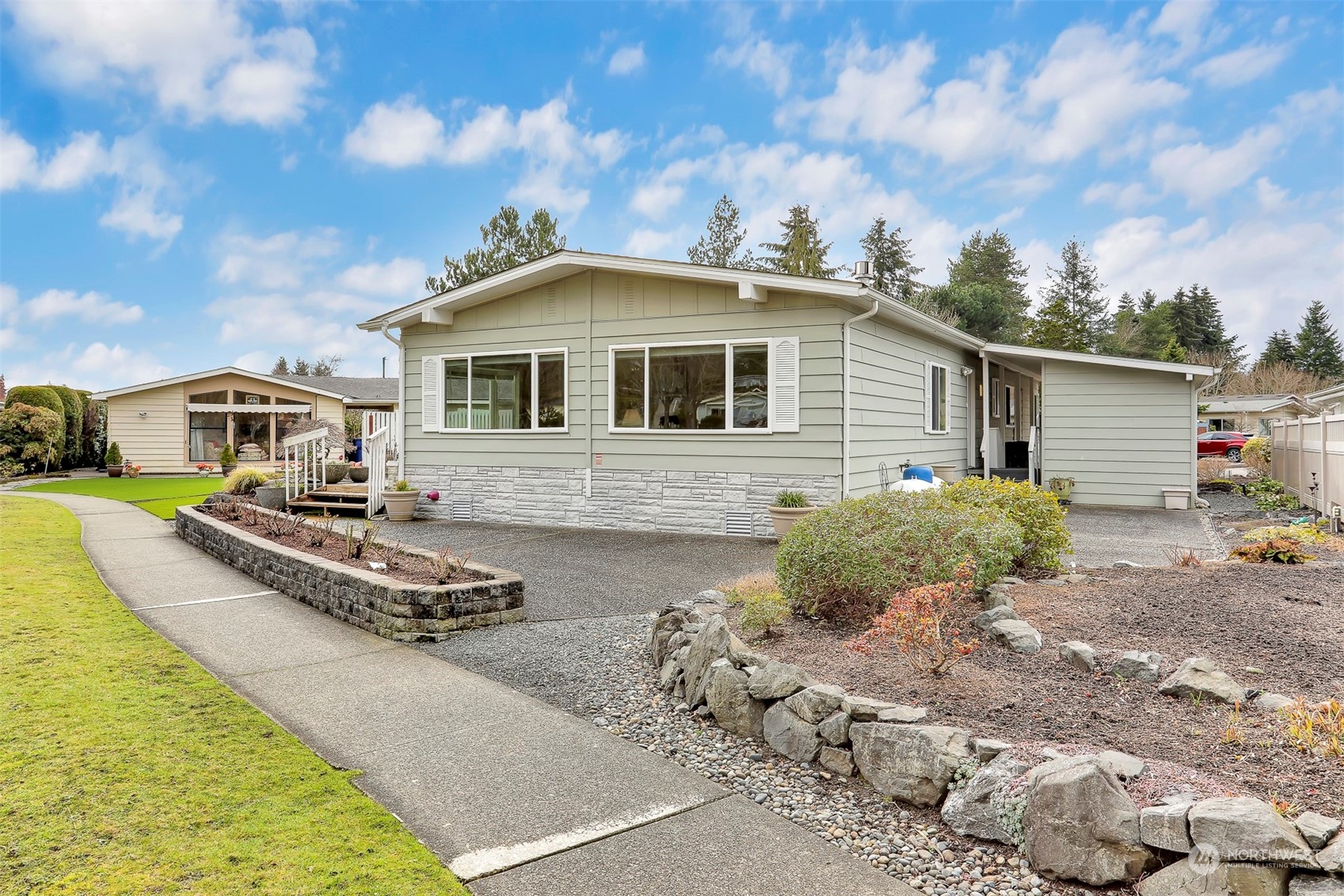 23921 Lake Drive West Bothell, WA 98021 - Photo 30 of 40 a front view of house with yard and trees in the background