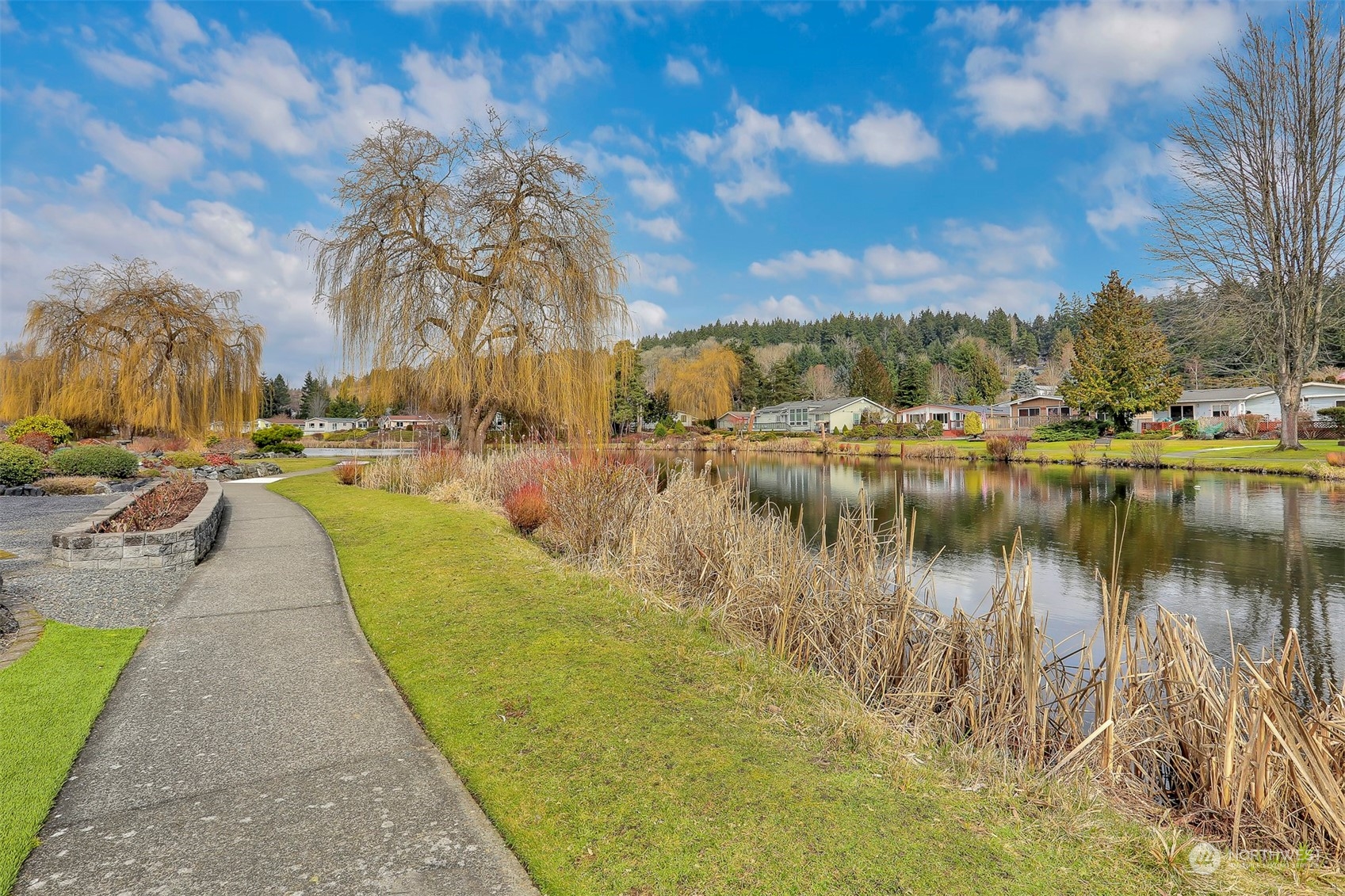 23921 Lake Drive West Bothell, WA 98021 - Photo 3 of 40 a view of a lake with houses