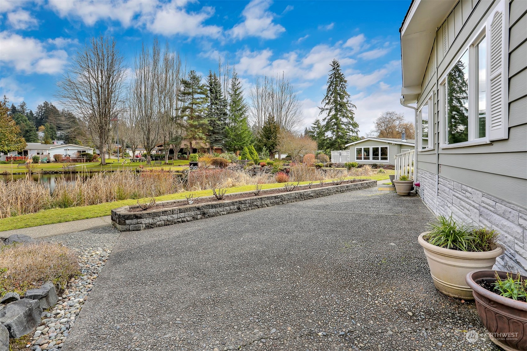 23921 Lake Drive West Bothell, WA 98021 - Photo 31 of 40 a view of a patio with swimming pool and outdoor seating