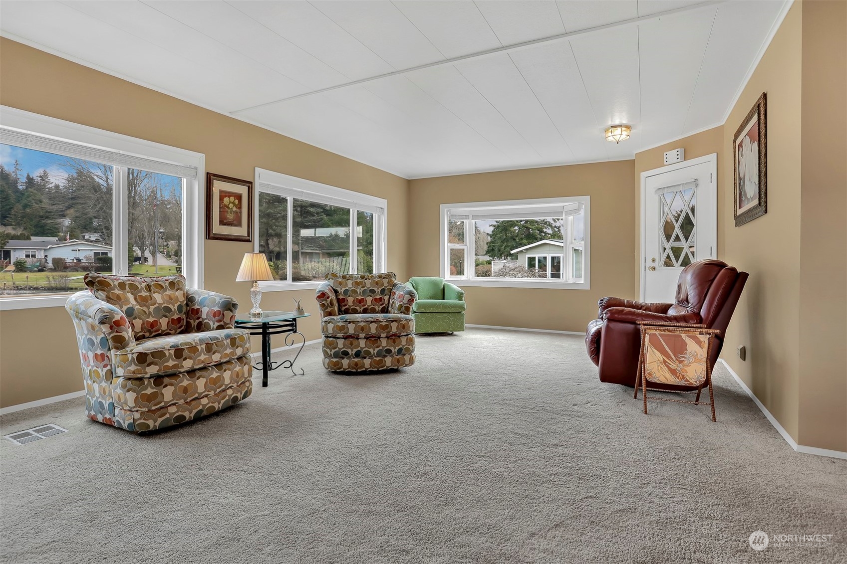 23921 Lake Drive West Bothell, WA 98021 - Photo 4 of 40 a living room with furniture and a large window