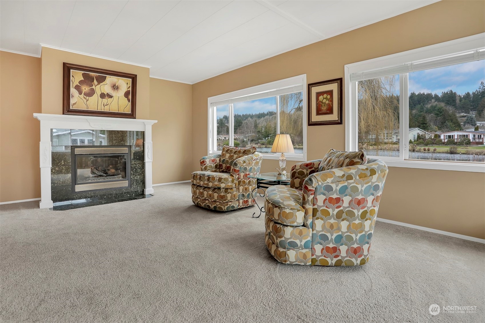 23921 Lake Drive West Bothell, WA 98021 - Photo 5 of 40 a living room with furniture and a fireplace