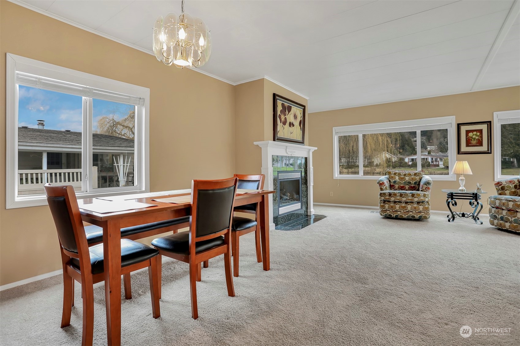 23921 Lake Drive West Bothell, WA 98021 - Photo 9 of 40 a dining room with furniture a livingroom and chandelier