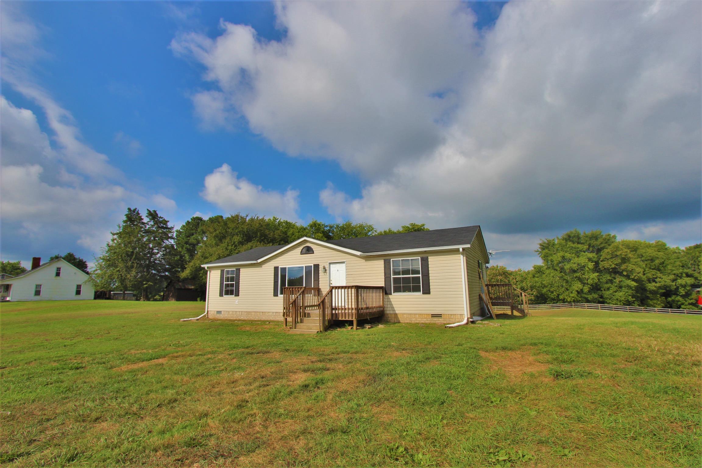 4430 Beasleys Bend Road Lebanon, TN 37087 - Photo 2 of 16 a front view of a house with yard and green space