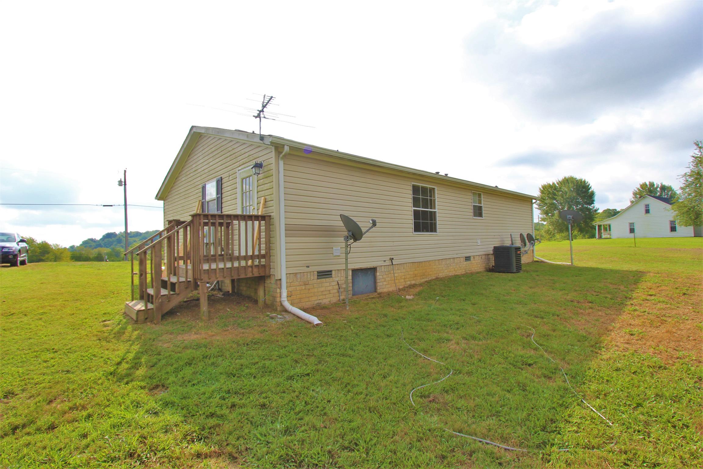 4430 Beasleys Bend Road Lebanon, TN 37087 - Photo 16 of 16 a backyard of a house with table and chairs