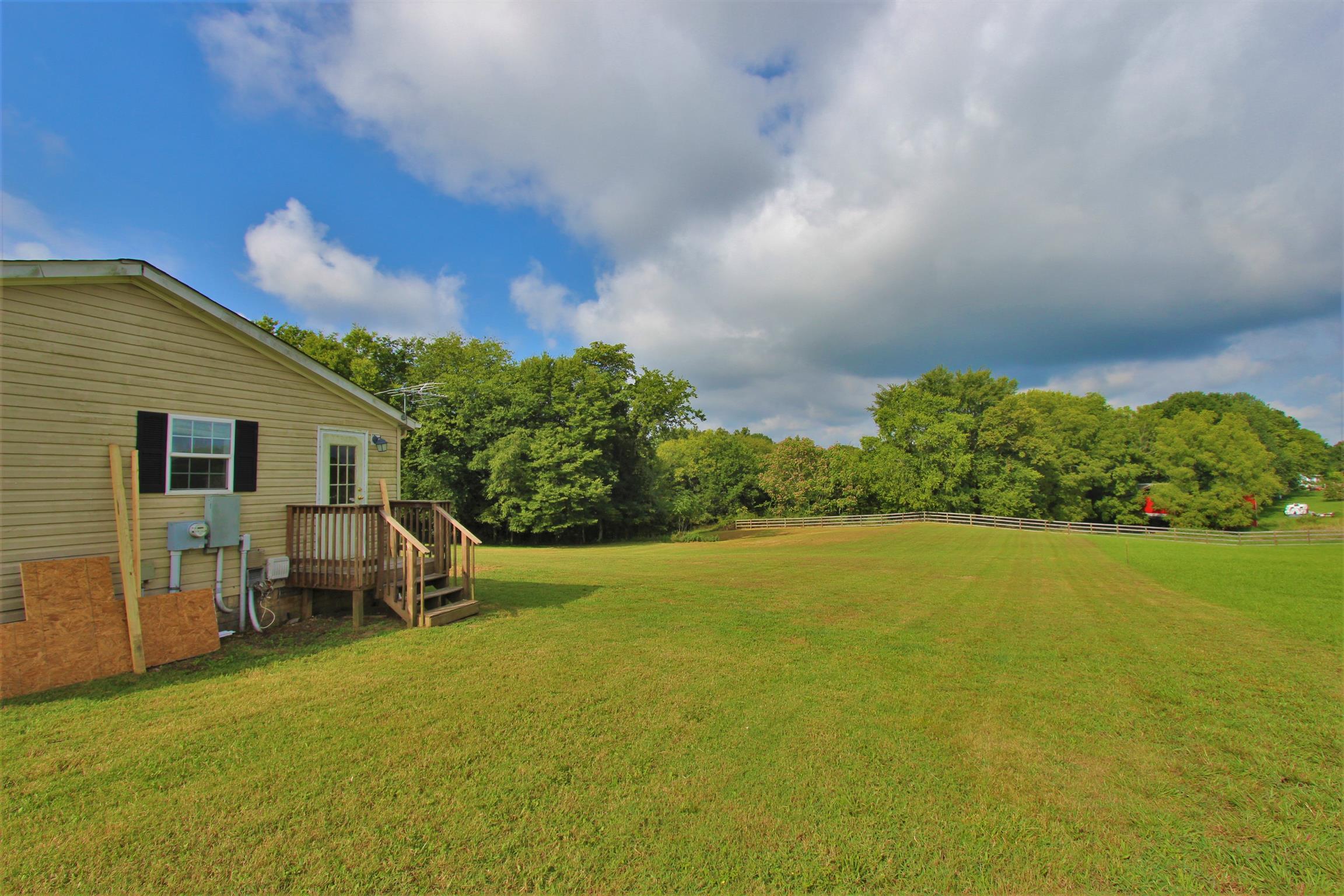 4430 Beasleys Bend Road Lebanon, TN 37087 - Photo 3 of 16 a backyard of a house with table and chairs