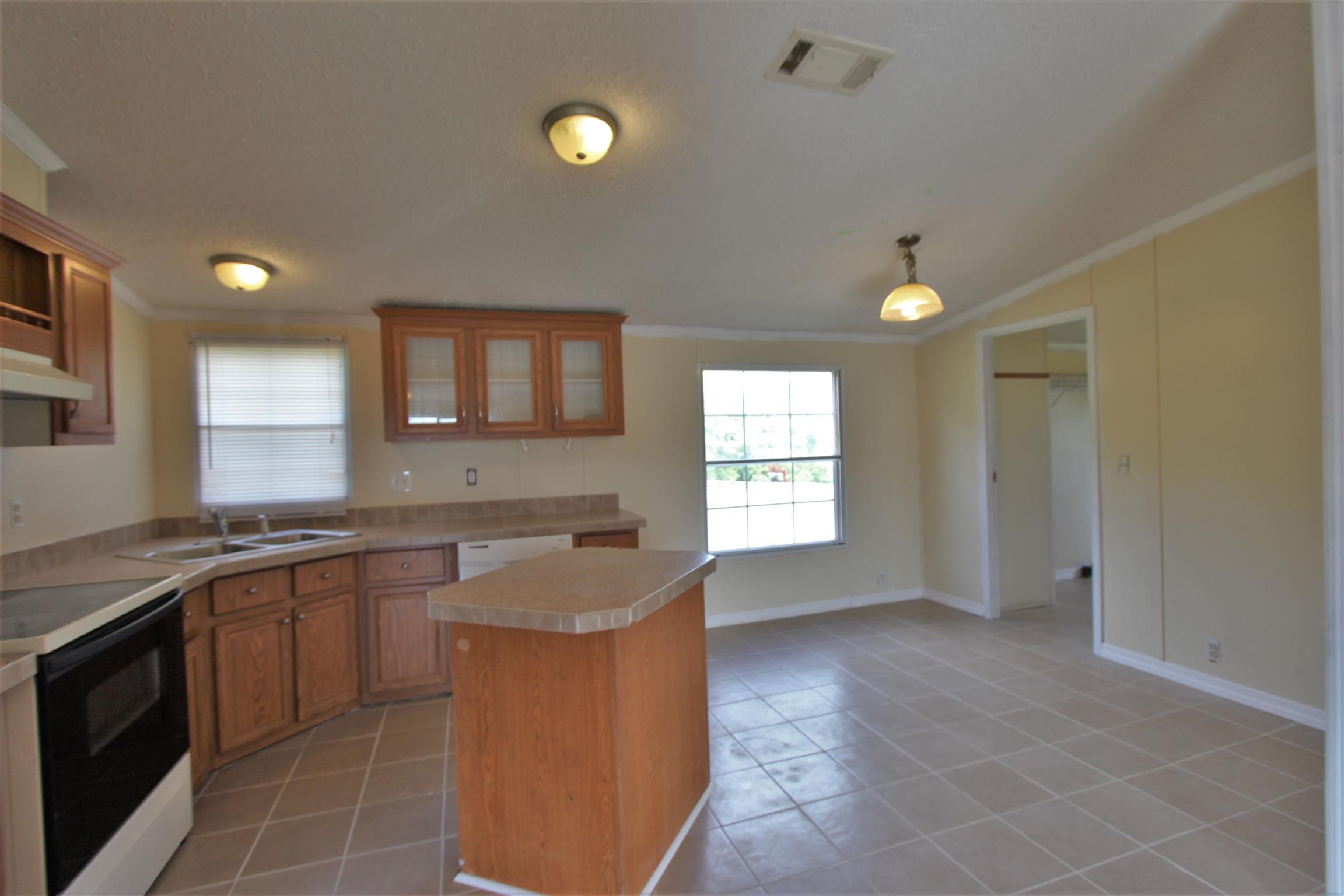 4430 Beasleys Bend Road Lebanon, TN 37087 - Photo 7 of 16 a kitchen with a sink stove and cabinets