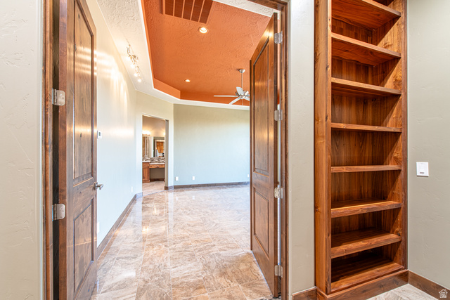 322 340 E Street Ivins, UT 84738 - Photo 23 of 61 Hallway featuring built-in wood shelving and a solid wood door