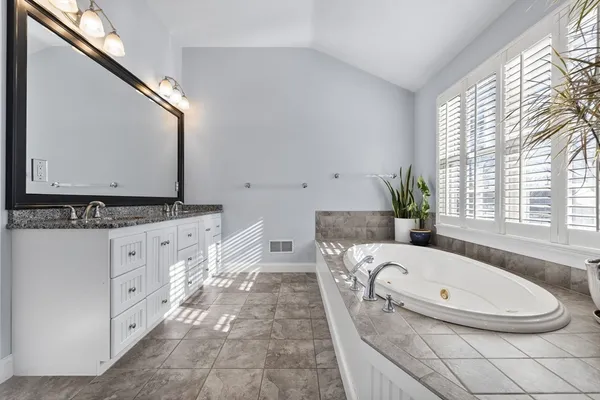 a bed room with a bed and a dresser