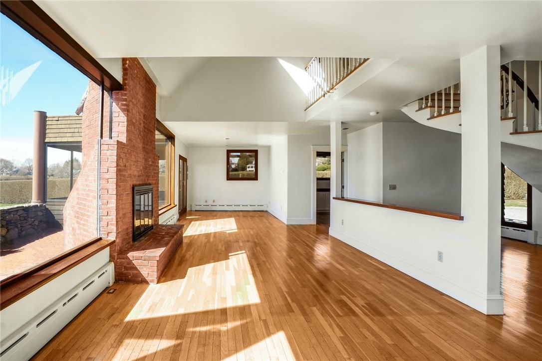 10 Emerson Road Jamestown, RI 02835 - Photo 12 of 31 This sun-filled Living Room and Dining Area is 12' x 30'.