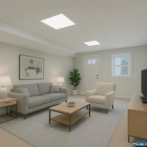 a living room with furniture and a potted plant