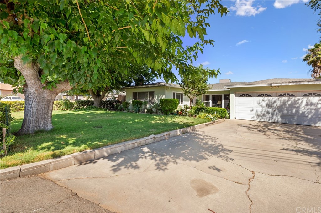 4881 Jones Avenue Riverside, CA 92505 - Photo 1 of 1 a view of a white house with a yard