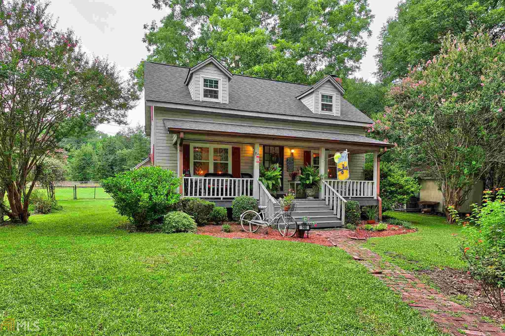 146 Smith Road Newnan, GA 30263 - Photo 1 of 1 a front view of a house with garden