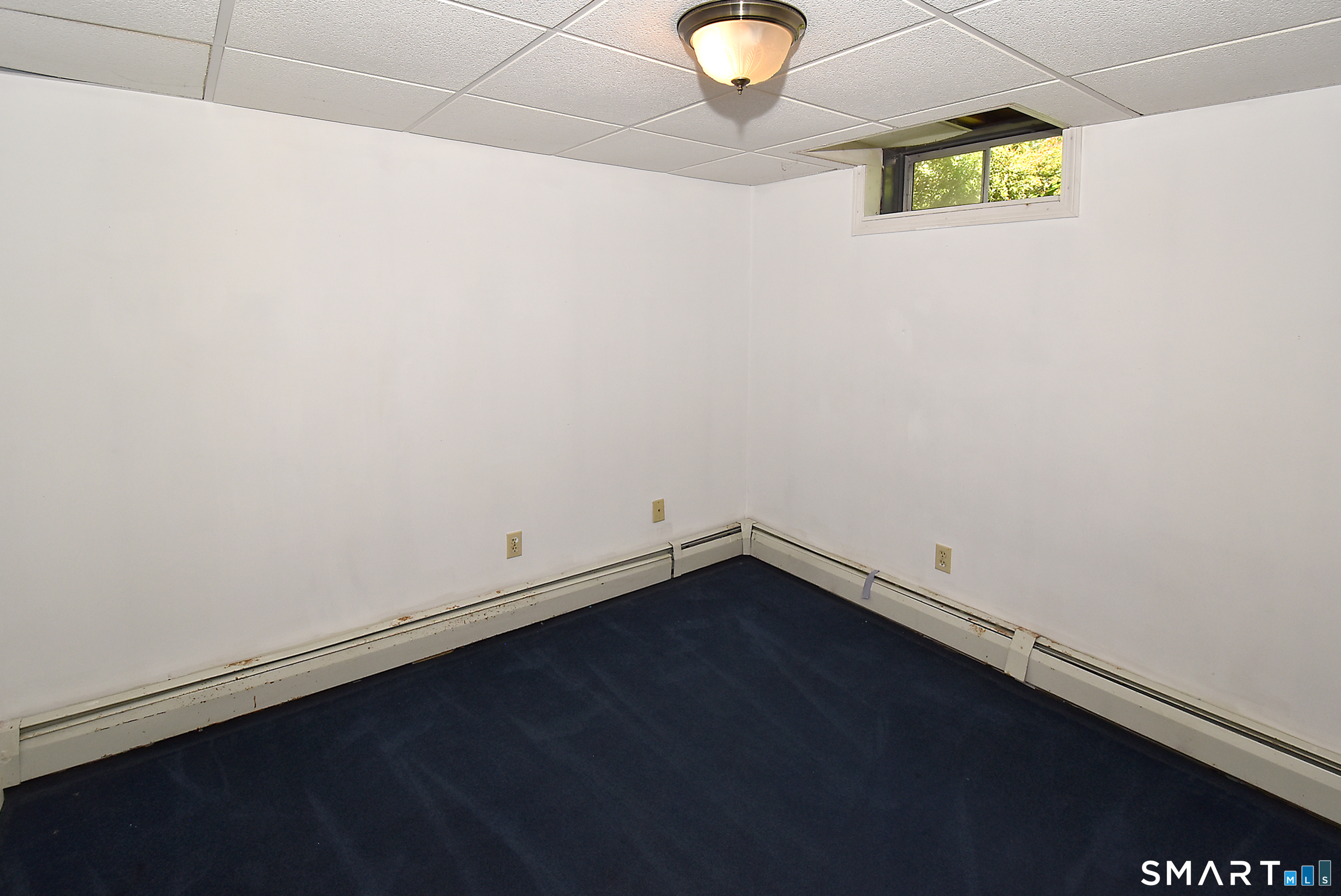 90 Forest Road Coventry, CT 06238 - Photo 21 of 26 Small office room with door in the basement.