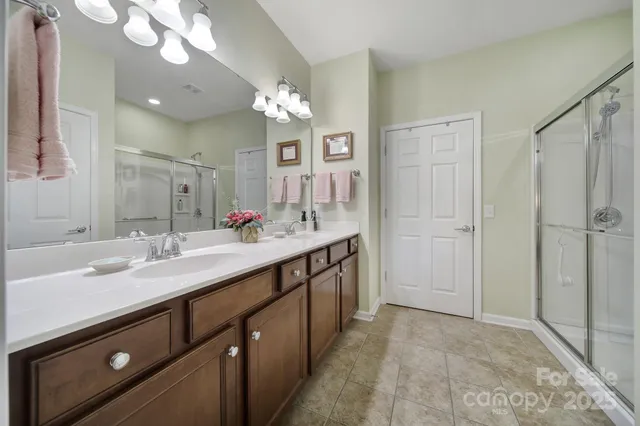 a spacious bathroom with a double vanity sink mirror and double