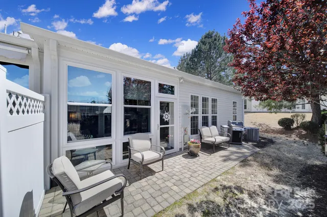 a outdoor space with patio furniture and potted plants