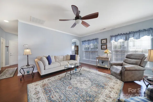 a living room with furniture or couch and a wooden floor