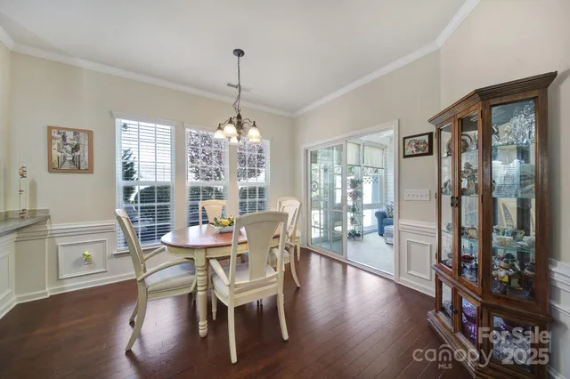 a dining room with furniture window wooden floor