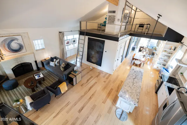 a view of a kitchen with a sink a washer and dryer