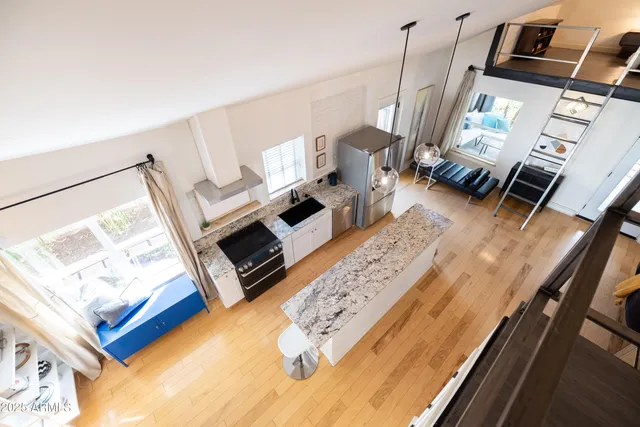 a bedroom with a bed and a chair