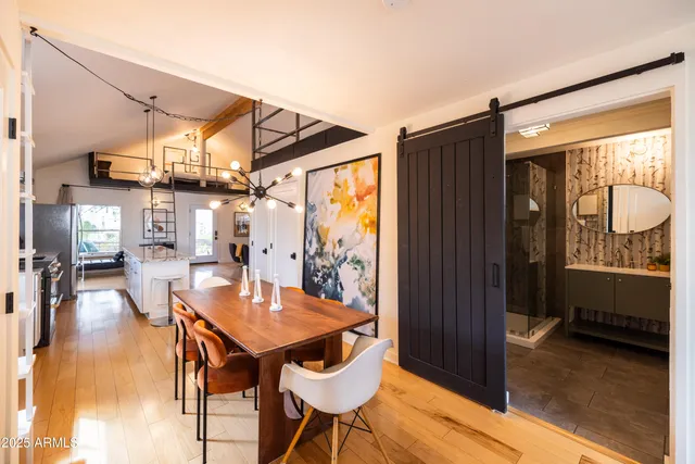 a bathroom with a granite countertop toilet sink and mirror