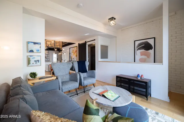 a balcony with furniture and a potted plant