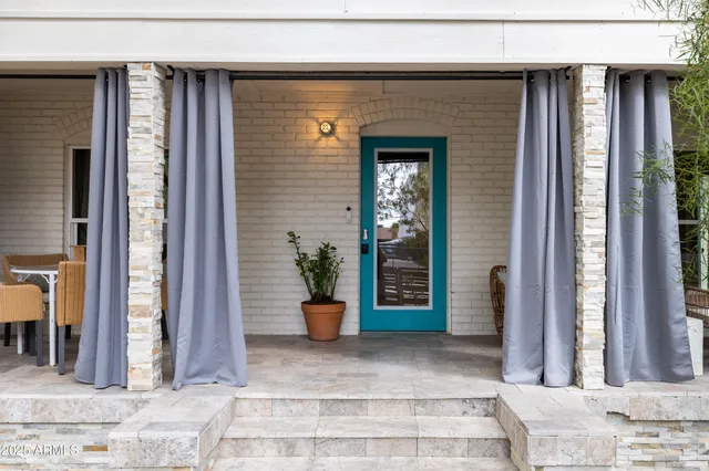 a living room with furniture fireplace and a flat screen tv