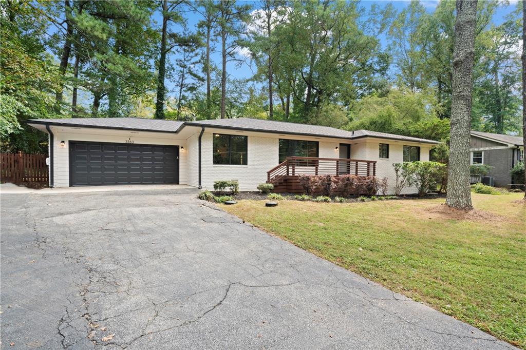 3363 Briarcliff Road Northeast Atlanta, GA 30345 - Photo 2 of 44 a front view of house with yard and trees in the background