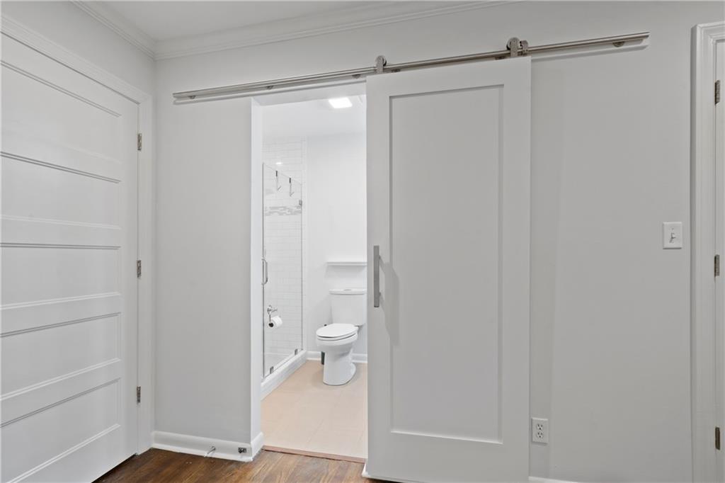 3363 Briarcliff Road Northeast Atlanta, GA 30345 - Photo 27 of 44 a bathroom with a shower and a toilet