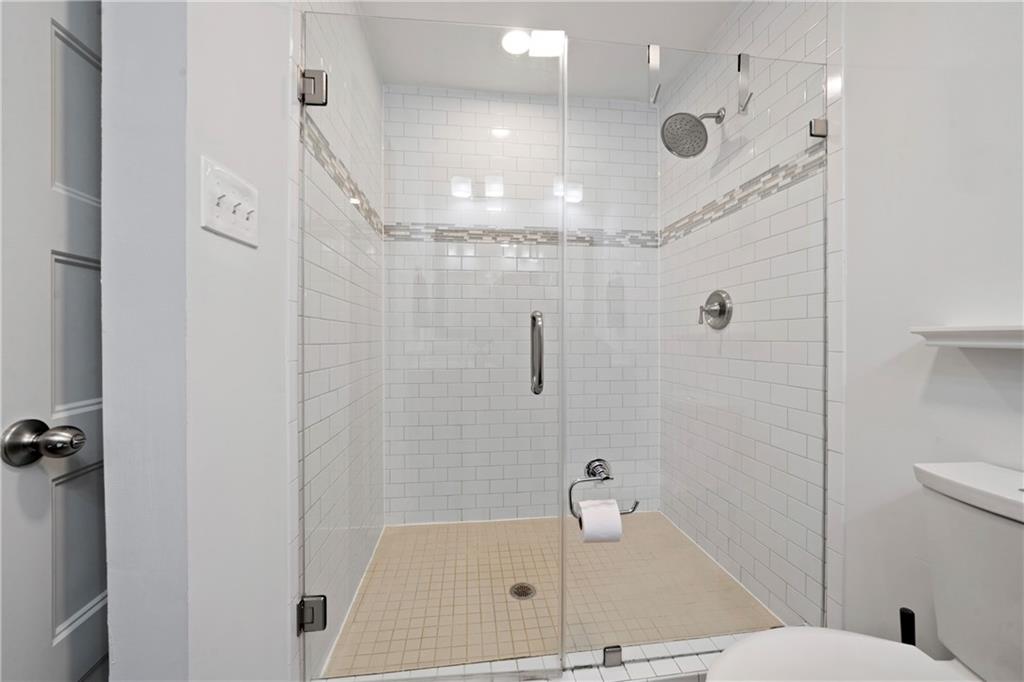 3363 Briarcliff Road Northeast Atlanta, GA 30345 - Photo 29 of 44 a bathroom with a shower and a toilet