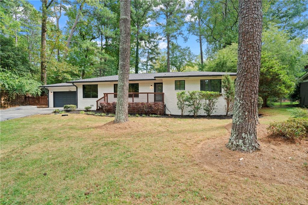 3363 Briarcliff Road Northeast Atlanta, GA 30345 - Photo 3 of 44 a view of a house with backyard and a garden